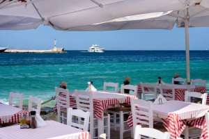 Dining outside during your Greek cooking vacation.