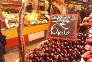 Enjoying a market visit in Malaga during a Spain food tour.