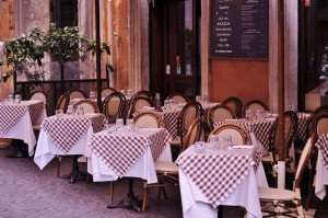Dining outside at a French cafe during a cooking vacation in Paris.