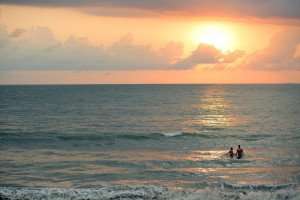 Enjoying the sunset during a beach vacation with The International Kitchen.