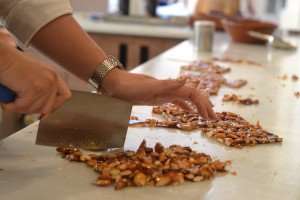 Chopping freshly made nougat during a Paris cooking class.