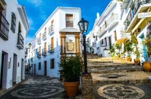 A view of a picturesque street in old town of Frigiliana, Spain.