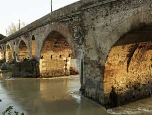 The ancient Roman bridge, Ponte Milvio, as seen from the water. 
