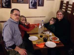 TIK's Peg at a pizzeria in Rome with her family.