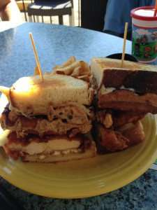 A chicken and waffles sandwich.