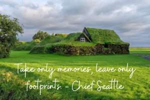 A Chief Seattle travel quote over a picture of a green turf house.