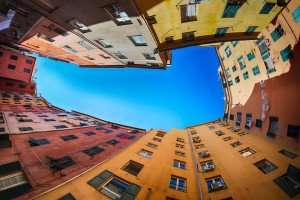 The buildings of Genoa around a small piazza.