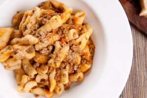 Delicious homemade cavatelli pasta with a meat ragu, made during your authentic culinary vacation in Italy.