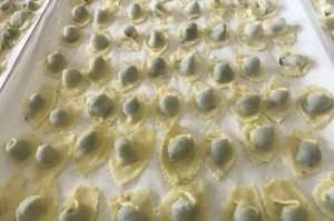 Enjoying pansotti pasta, a local specialty of Liguria, during a cooking vacation on the Italian Riviera with The International Kitchen.