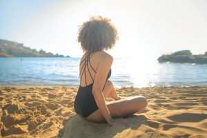 Portrait of a beautiful woman enjoying a beach vacation.
