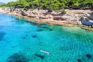 Snorkeling at a beautiful beach off the island of Aegina, Greece.