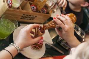Adding some hot sauce during a Mexico City food tour.