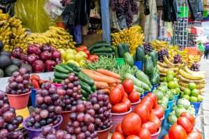 Visiting the local produce market on a culinary vacation in Mexico.