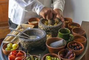 Creating a traditional Pasilla sauce on a culinary vacation in Mexico.