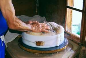 Making cheese the old fashioned way.