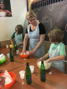 Making pizza dough during a cooking class in Naples.
