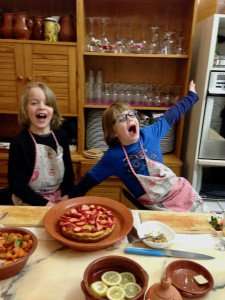 Happy kids during a cooking class in Portugal.
