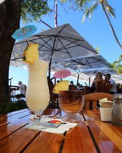 Enjoying cocktails on the beach during a Puerto Rico culinary tour.