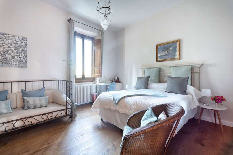 Image for A bedroom at the luxury Tuscan villa.