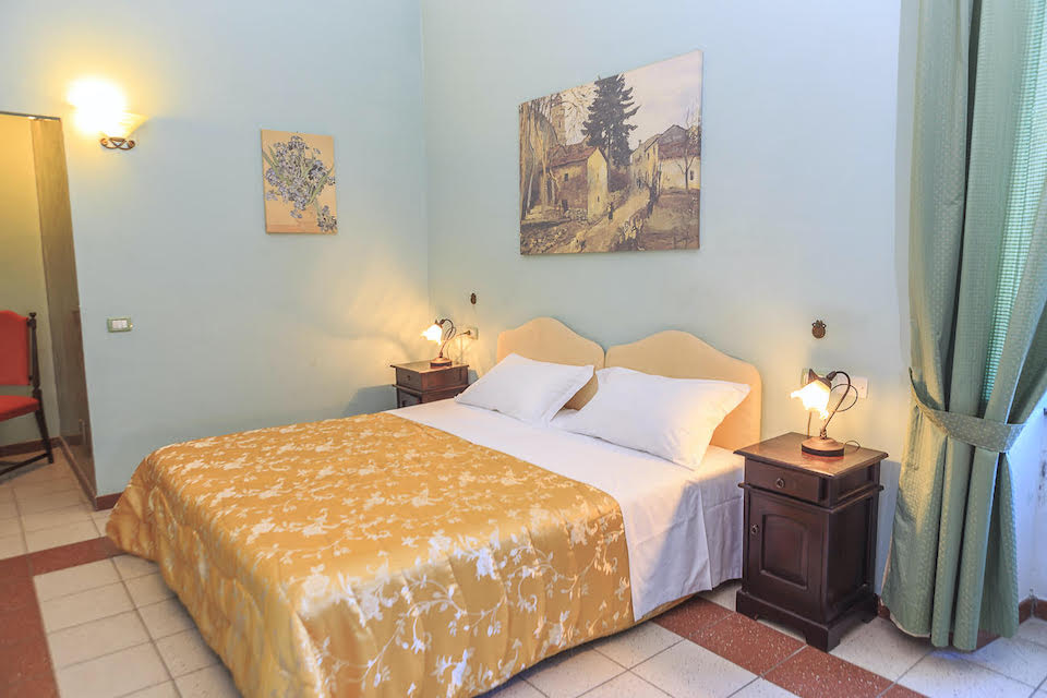 Image for A bedroom at the palazzo, home for your cooking vacation in Abruzzo.
