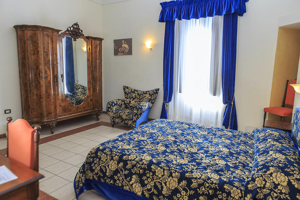 Image for A double bedroom at the palazzo, home for your cooking vacation in Abruzzo.