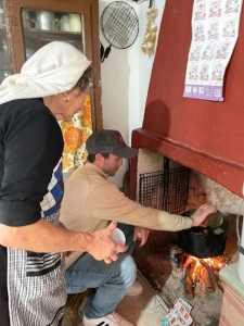 Tending the fire, and the chicken!