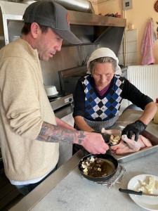 Cooking with 'grandma' during a Greek cooking class.