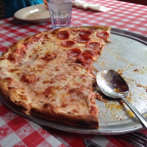 New York style pizza, half cheese and half pepperoni.
