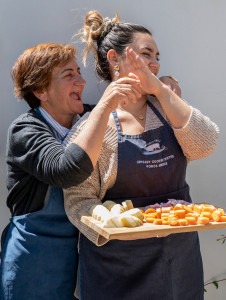 Chefs Katerina and Dora joking around while cooking together.