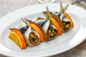 Sarde a Beccafico, traditional Sicilian cuisine, anchovy rolls stuffed bread crumbs, raisins and pine nuts.