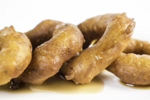 Peruvian picarones, a ring-shaped treat made with squash or sweet potato.