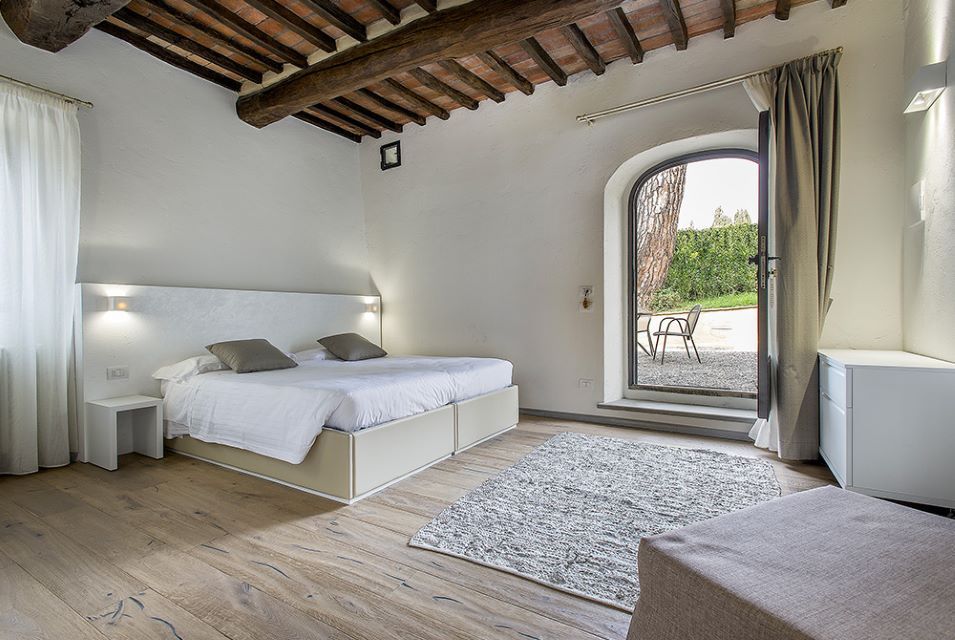The airy deluxe bedroom of the modern medieval village