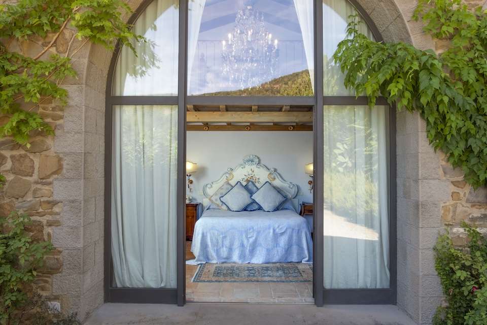 Image for A view of a suite at the Tuscan estate.
