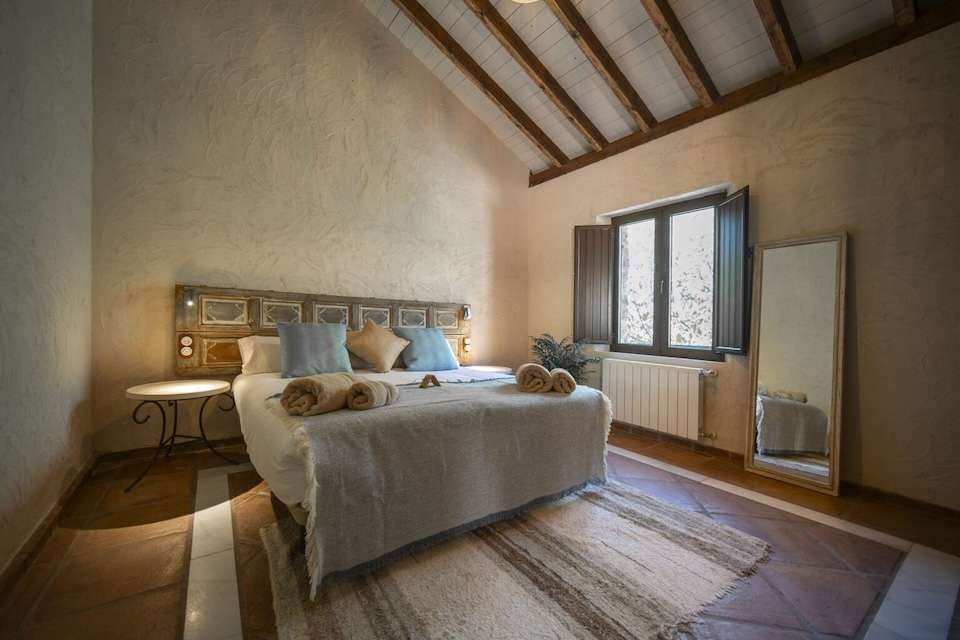 Image for Bedroom at the eco hotel Cueva del Gato.
