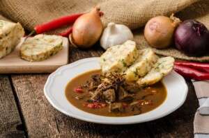 Classic Czech goulash with dumplings, delicious heavy food, homemade Karlovarsky dumplings
