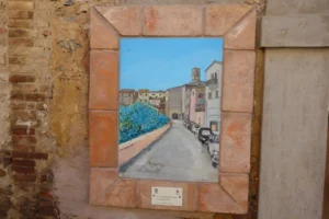 Art adorns the town's streets, embedded in its walls.