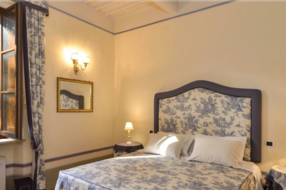 Image for Stay in one of the villa's luxurious bedrooms. Image © Tenuta Villa Rocchi